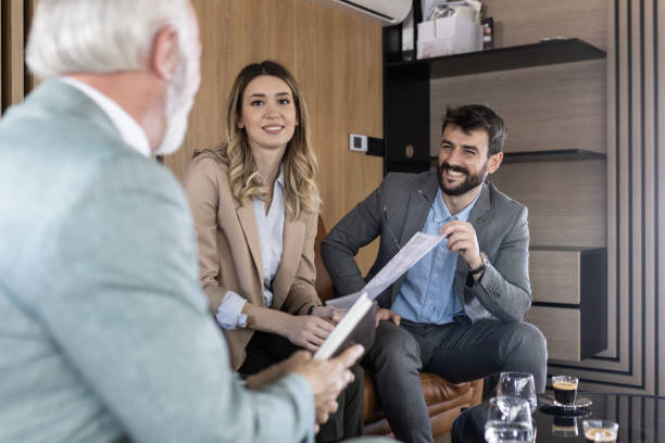 istock Young couple buying a car 1367150221