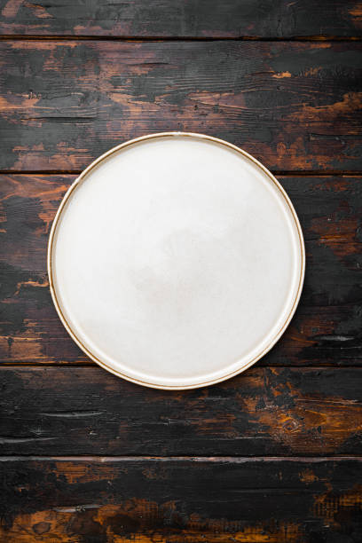 istock Rustic plate with copy space for text or food with copy space for text or food, top view flat lay , on old dark  wooden table background 1367153188