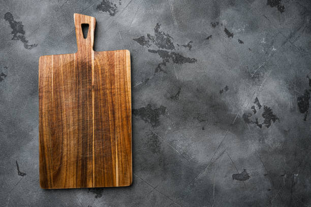 istock Bamboo cutting board empty for empty for copy space for text or food, top view flat lay , on gray stone table background 1367153320