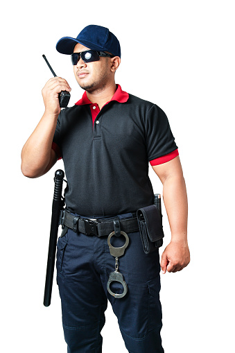 security guard wears dark glasses and wears a hat.holding a walkie-talkie with rubber batons ready and handcuffs on a tactical belt on a isolated white background Eliminate the concept of security