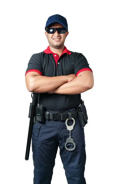 The security guard wears black glasses and wears a hat.stand with arms crossed, rubber batons and handcuffs on tactical belts. on a isolated white background Eliminate the concept of security