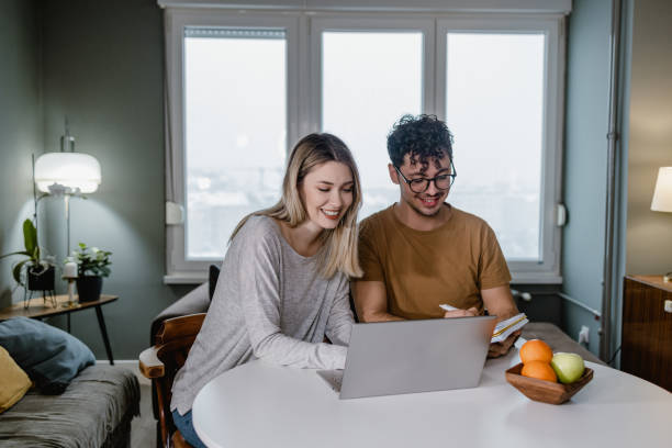 istock Young couple taking care of home finances 1367154792
