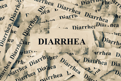 Strips of newspaper with the words Diarrhea typed on them. Diarrhea concept.