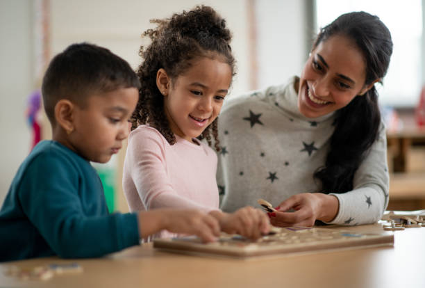 istock The Teacher Lends a Hand 1367156702
