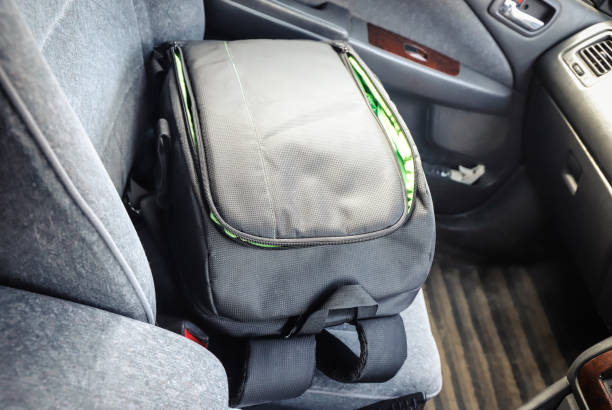 istock Backpack for the camera on the car seat 1367156772