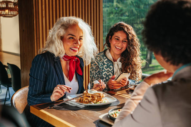 istock Female friends having a great time in restaurant 1367158088