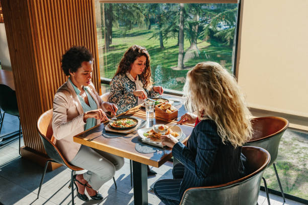 istock Female friends having a great time in cafe 1367158089