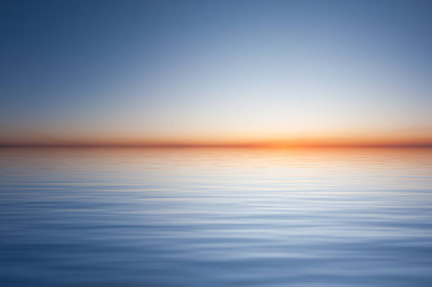 istock Water surface with waves and clear blue sky landscape 1367159152