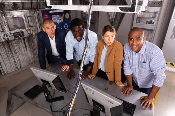istock Multiracial people   in escape room 1367159563