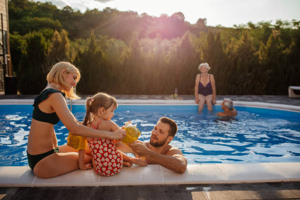 istock Putting on equipment for swimming at the pool 1367159617