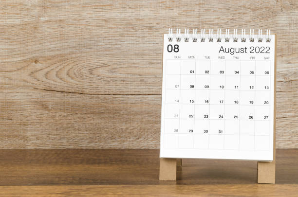 istock August 2022 desk calendar on wooden background. 1367161262