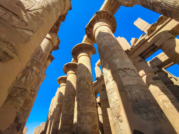 istock Big columns with hieroglyphics inside beautiful Karnak temple, Luxor, Egypt 1367161456