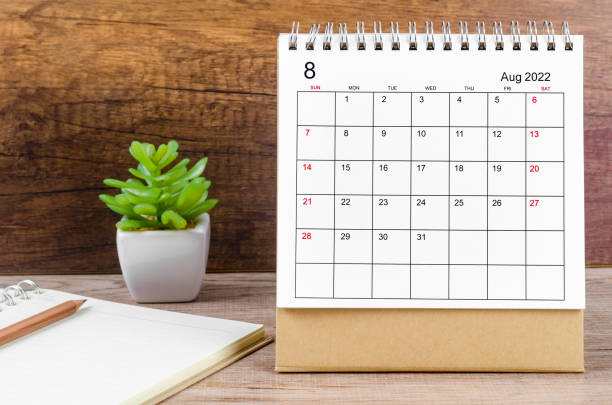 istock August 2022 desk calendar on wooden table. 1367162622