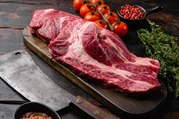 istock Black Angus Prime raw beef steak Chuck eye roll, on old dark  wooden table background 1367163042