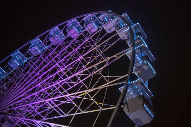 purple lights on a ferris wheel