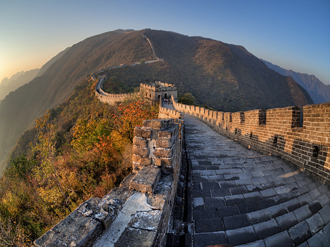 Snaking section of the Great Wall of China and surrounding mountains in the colours of Autumn