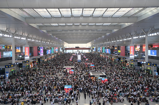 Shanghai.China-Oct.1st 2021: crowded Chinese travellers in Shanghai Hongqiao Railway Station during China's National Day. A lot of passengers in waiting hall.