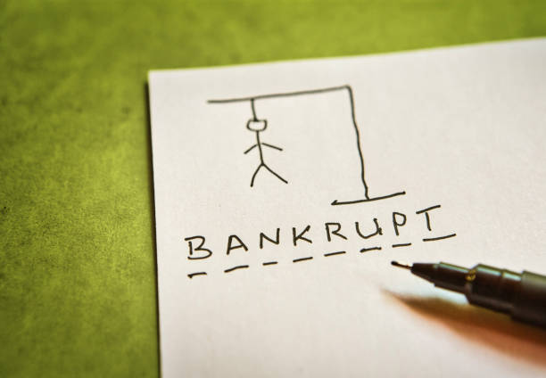Bankrupt, says the solution to a traditional word game of Hangman Hangman word game with the word BANKRUPT. Edit out one or two letters for authenticity. hangman stock pictures, royalty-free photos & images