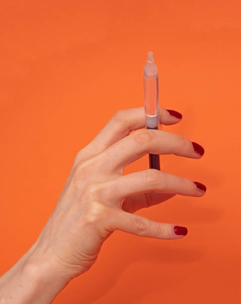 istock Female hand with full syringe 1367168743