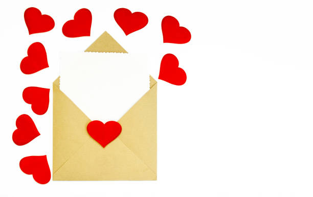 istock A kraft envelope with red hearts on a white background. A white sheet for a note in an envelope. The concept of Valentine's day, love, anniversary. copy space. flatlay 1367169843