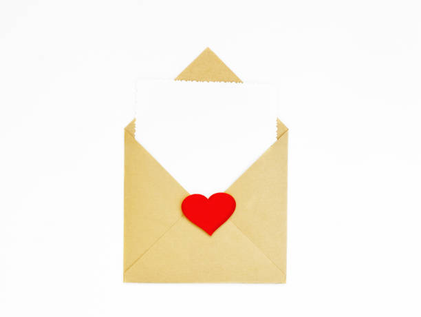 istock A kraft envelope with red hearts on a white background. A white sheet for a note in an envelope. The concept of Valentine's day, love, anniversary. copy space. flatlay 1367169868