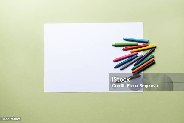 Colorful Crayons And Blank Paper Stock Photo - Download Image Now - Crayon, Paper, Desk