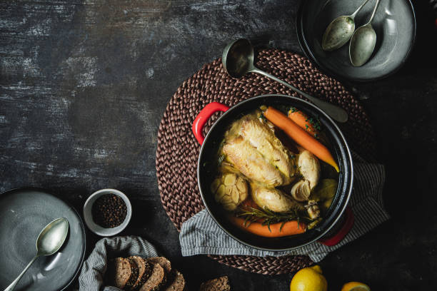 istock Freshly prepared chicken soup  with bread on kitchen counter 1367170915