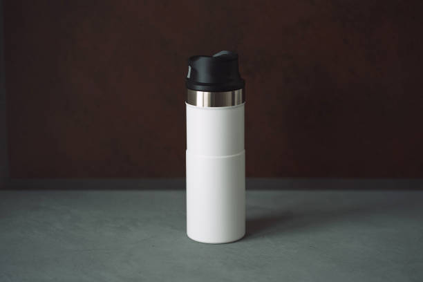 istock Mockup white thermo mug thermos for active lifestyle work and travel 1367171075