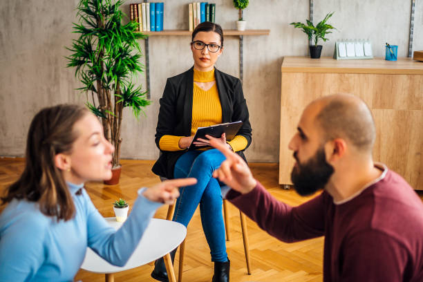 istock Couple having an argument during a counseling session 1367172817