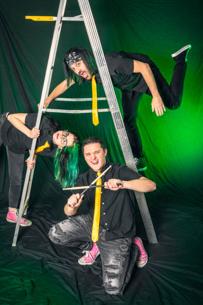 istock Rock Band Posing on a Metal Ladder 1367173461