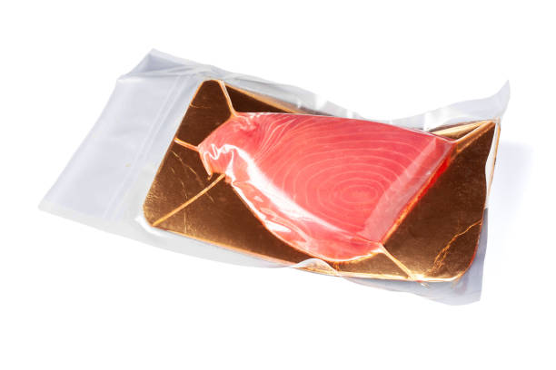 istock Fresh tuna fillet vacuum packed. Fish steak on a white background. Red fish textured steak isolated 1367173536