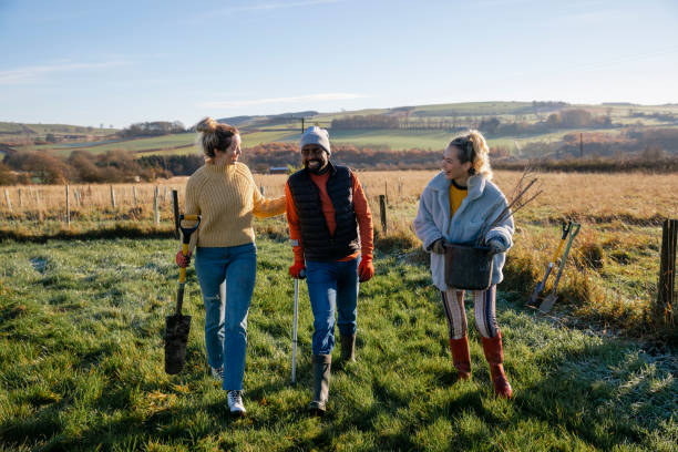 istock Friends Planting Trees To Fight Climate Change 1367176212