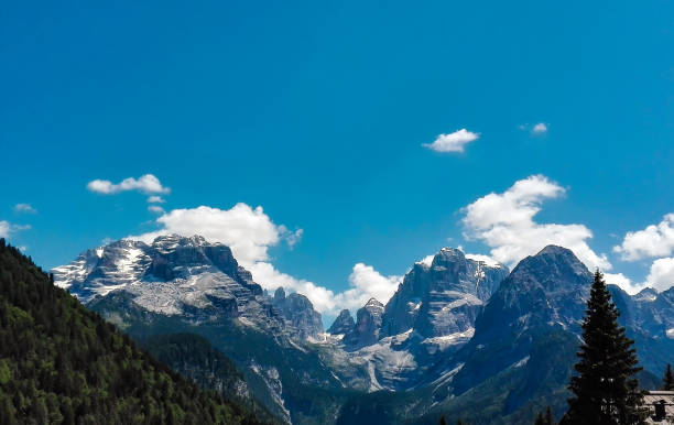 Panoramic view of the mountains from the path that leads to the 5 laghi refuge and Lake Ritorto in the Adamello-Brenta park in Trentino, travels and landscapes in Italy