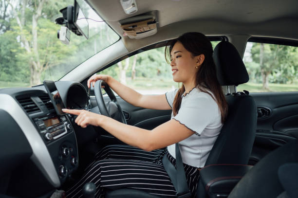 istock An Asian female E-hailing driver using smartphone to received order 1367182152