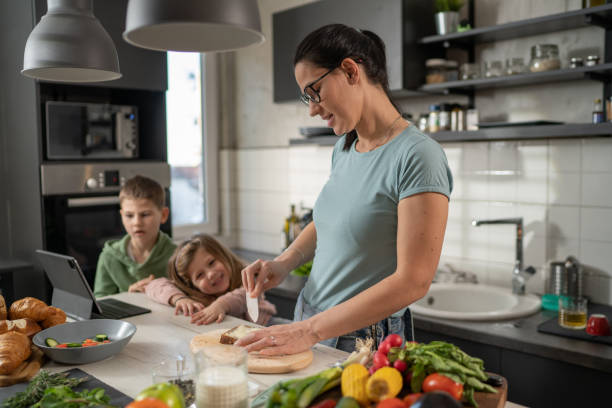 istock Mother making breakfast for kids 1367183905