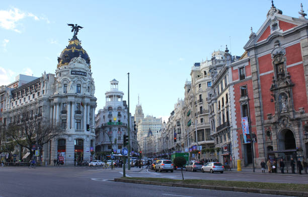 Madrid, Spain - 4 December 2012: Gran Via and Metropolis building in Madrid city downtown.