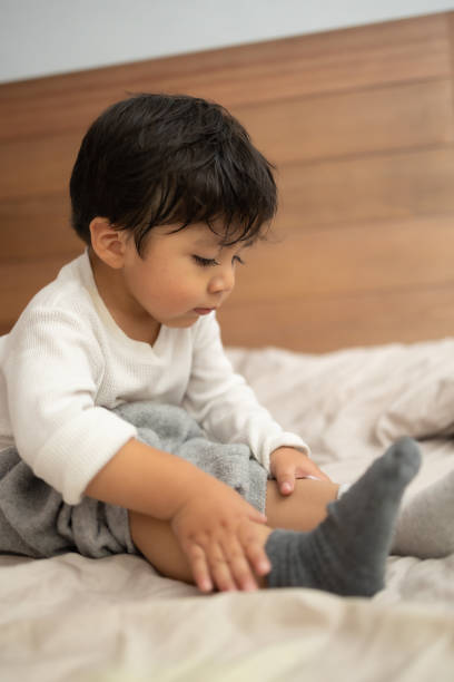 istock Mexican baby putting on body cream 1367187055