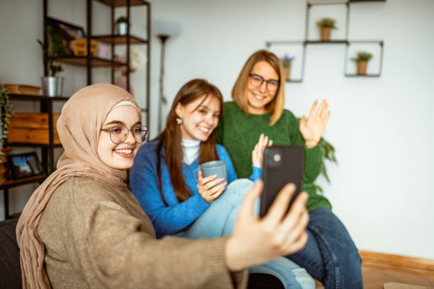 istock Three girlfriends enjoying coffee time together at home 1367187060