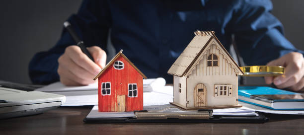 istock Real estate agent signing document for home loan insurance. 1367188060