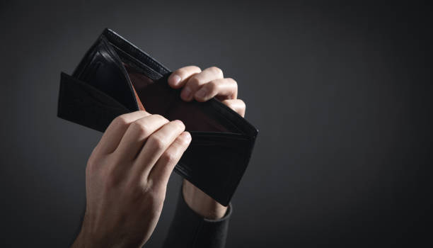istock Man showing empty wallet. Bankruptcy 1367188105
