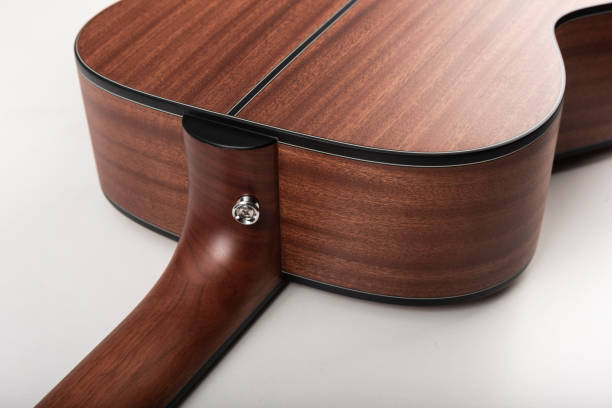 Traditional mahogany acoustic guitar stock photo