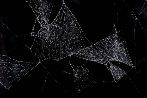 istock Cracks in glass. Broken black glass. 1367189941