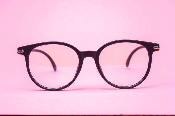 istock Stylish glasses on a pink background close-up. 1367189973