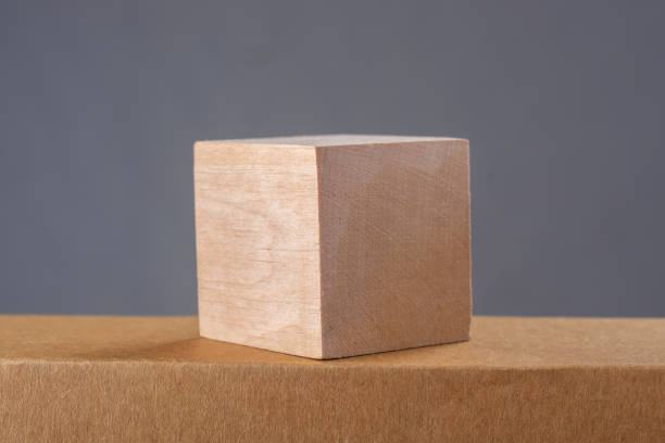 istock Business and design concept - abstract geometric real wooden cube. 1367189998