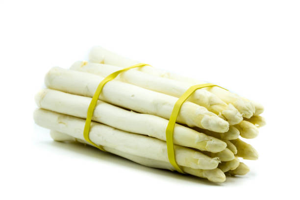 istock Green and white asparagus isolated on white background 1367191586
