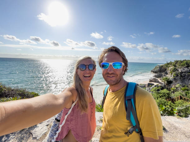 istock Couple take selfie in Mexico with sea on background 1367192076