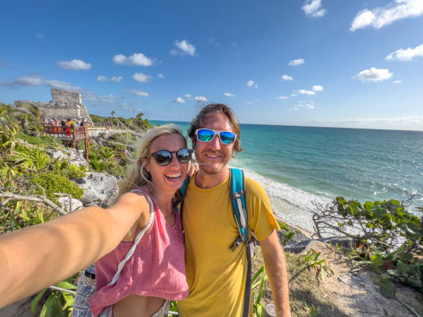 istock Couple take selfie with ancient temple in Mexico 1367192108