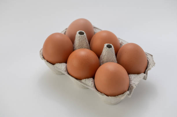 istock Closeup of fresh brown eggs in paper box 1367194932