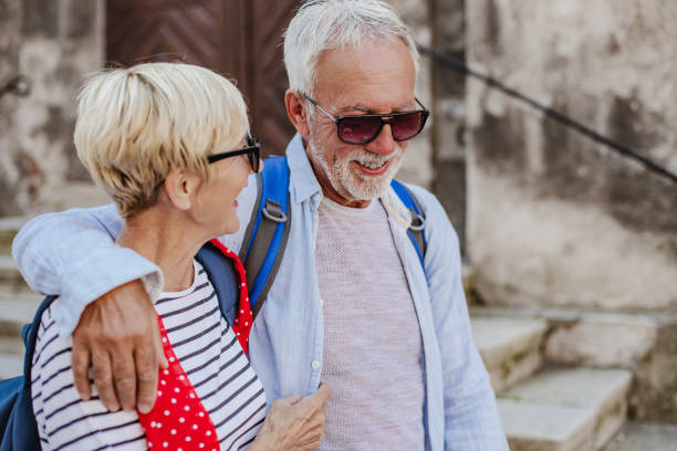 istock Cute senior couple exploring new city 1367195172