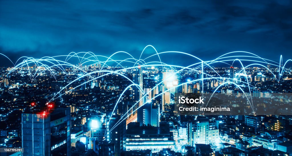 Smart City And Wireless Communication Network Technology Wireless connections on a futuristic city. Internet of Things Stock Photo